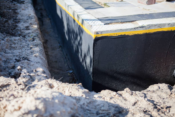 Professional Basement Waterproofing technician working in Mulberry, IN